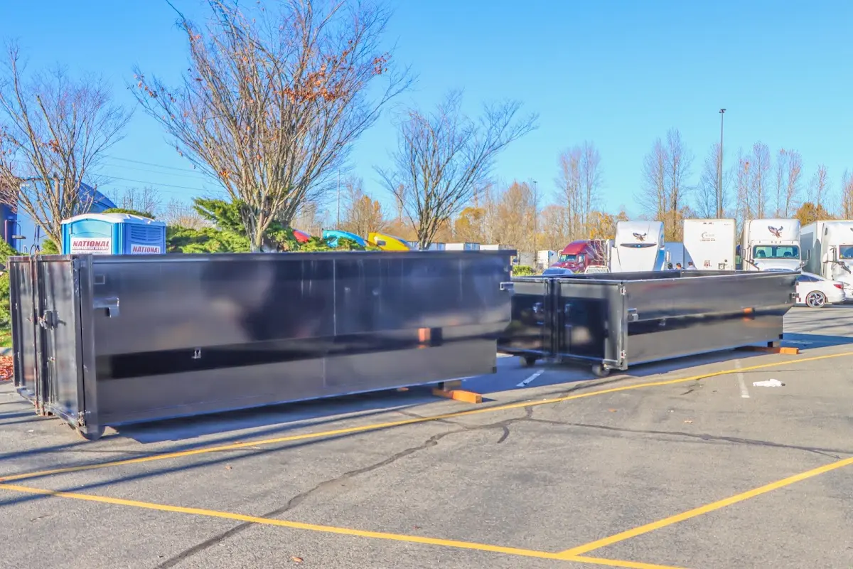 Professional dumpster rental service with roll-off container on residential driveway in Mountain House